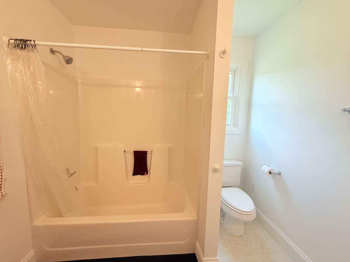 Combo shower tub in upstairs bathroom