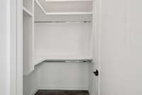 Has a walk-in closet with custom shelving.