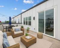 Virtually Staged. Spacious rooftop deck with great views!  Perfect for entertaining and relaxing!