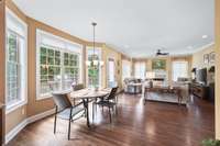 A bay window along with the other large widows make for a cheery ambiance.