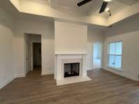 Coffered ceiling and fireplace in main living room.