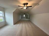 A bonus room for all occasions. The bonus room is above the 3 car garage and extends the full length. Great space for hobbies and or gatherings.