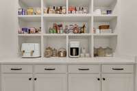 Large walk in pantry with outlets.