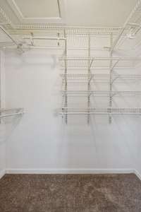 Adjustable shelving in the primary closets.