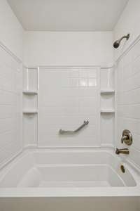 Big soaking tub in the hall bathroom
