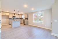 Kitchen with Island, Quartz Counter Tops, Stainless Appliances & Dining Area!!!