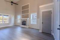 Great Room perfect for all your family gatherings highlighted with Volume Ceilings & Electric Fireplace !!!