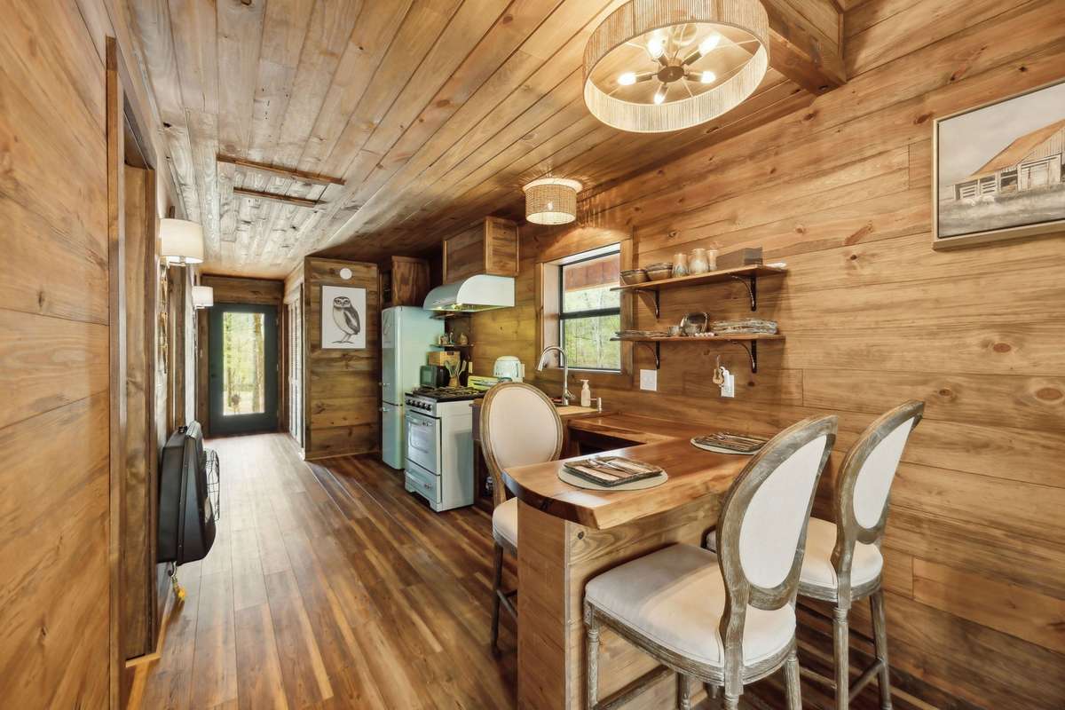 View of the kitchen from the back of the off grid cabin
