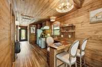 View of the kitchen from the back of the off grid cabin