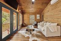 Sitting area in the off grid cabin facing the waterfall