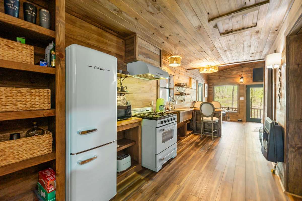 Charming interior of the off grid cabin with Smeg appliances
