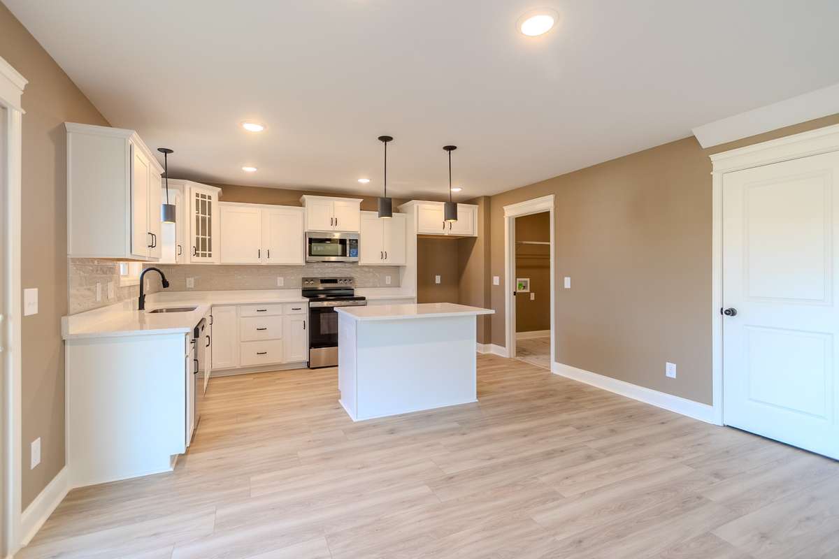 Gleaming White Cabinets Crowned with Quartz tops & Stainless Appliances !!!!