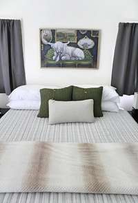 Casita has been turned into a sleeping quarters with a king bedroom with bunk beds.