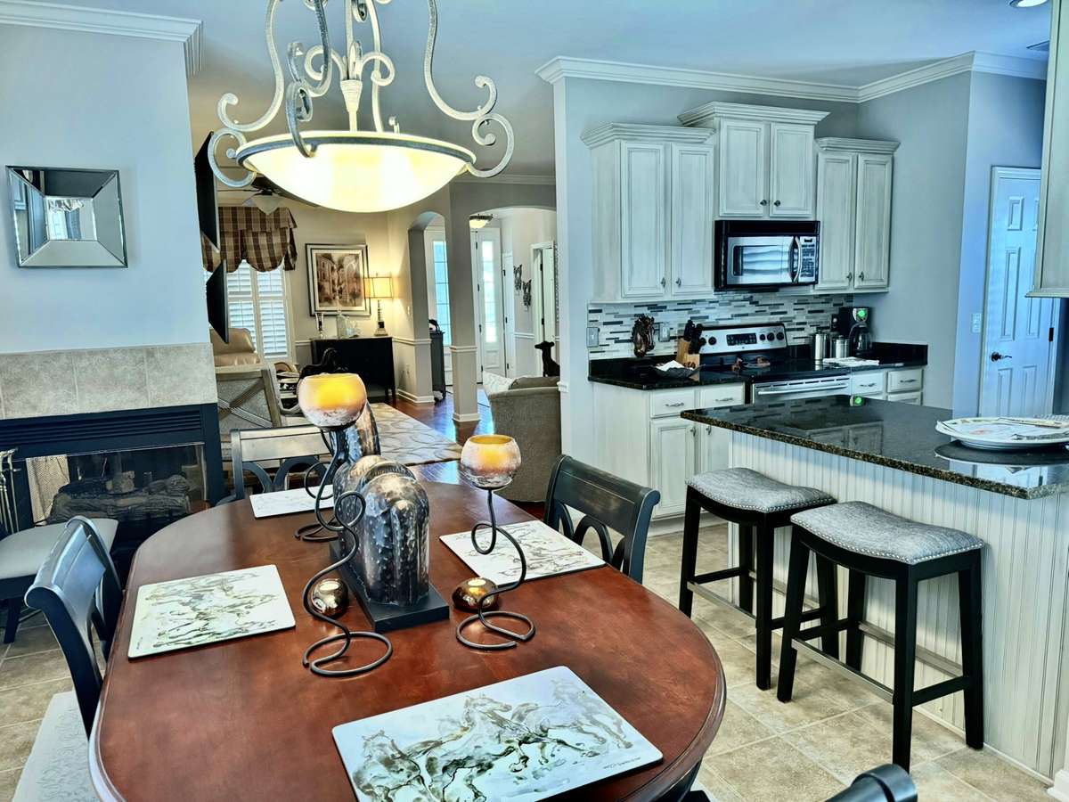 Everything Stays ! Just bring your Toothbrush and your ready! Gas Fireplace separates the Dinning Room from the Living Room.