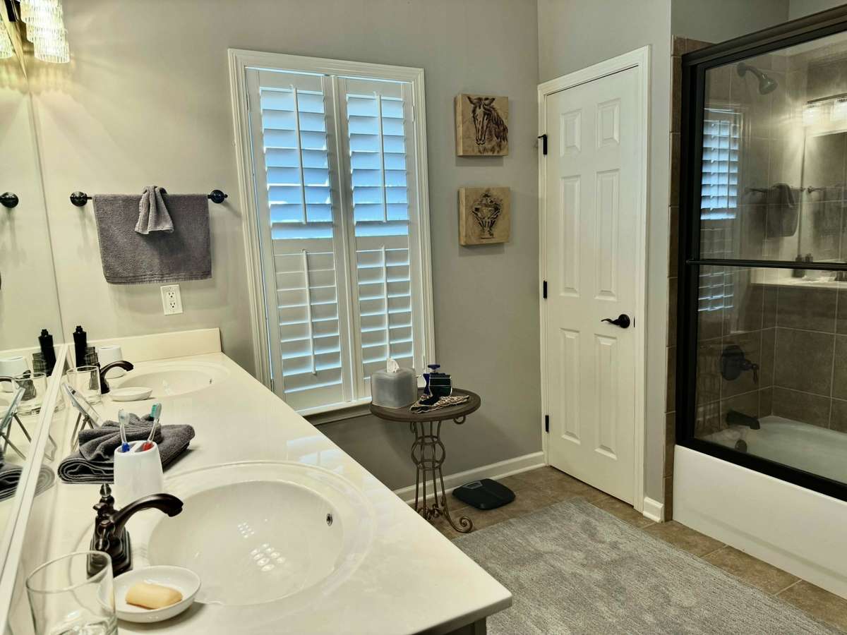 Primary Full Bath features 2 Closets, Water Closet, and Double Vanity