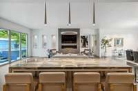 Kitchen island configured to face the fireplace/tv view if you should choose to.
