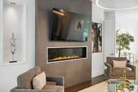Flawless remote controlled gas fireplace with glass front.