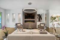 View from the island to the great room fireplace and TV. The island is intentionally configured to face this direction.