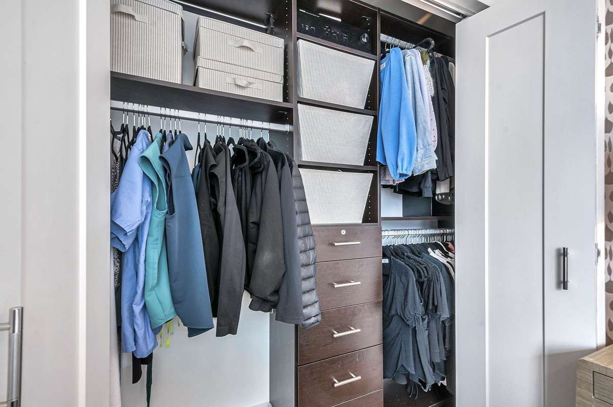 Primary closet is outfitted with a California Closet system for optimal organization.
