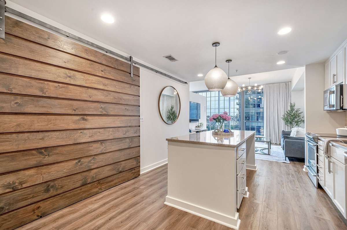 View of the space with the barn door closed -- the versatility of this floor plan is amazing!