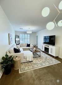 Pick your passion....couch to the left or couch to the right! This space is so long and versatile. It could also fit a desk against the wall if you needed it.