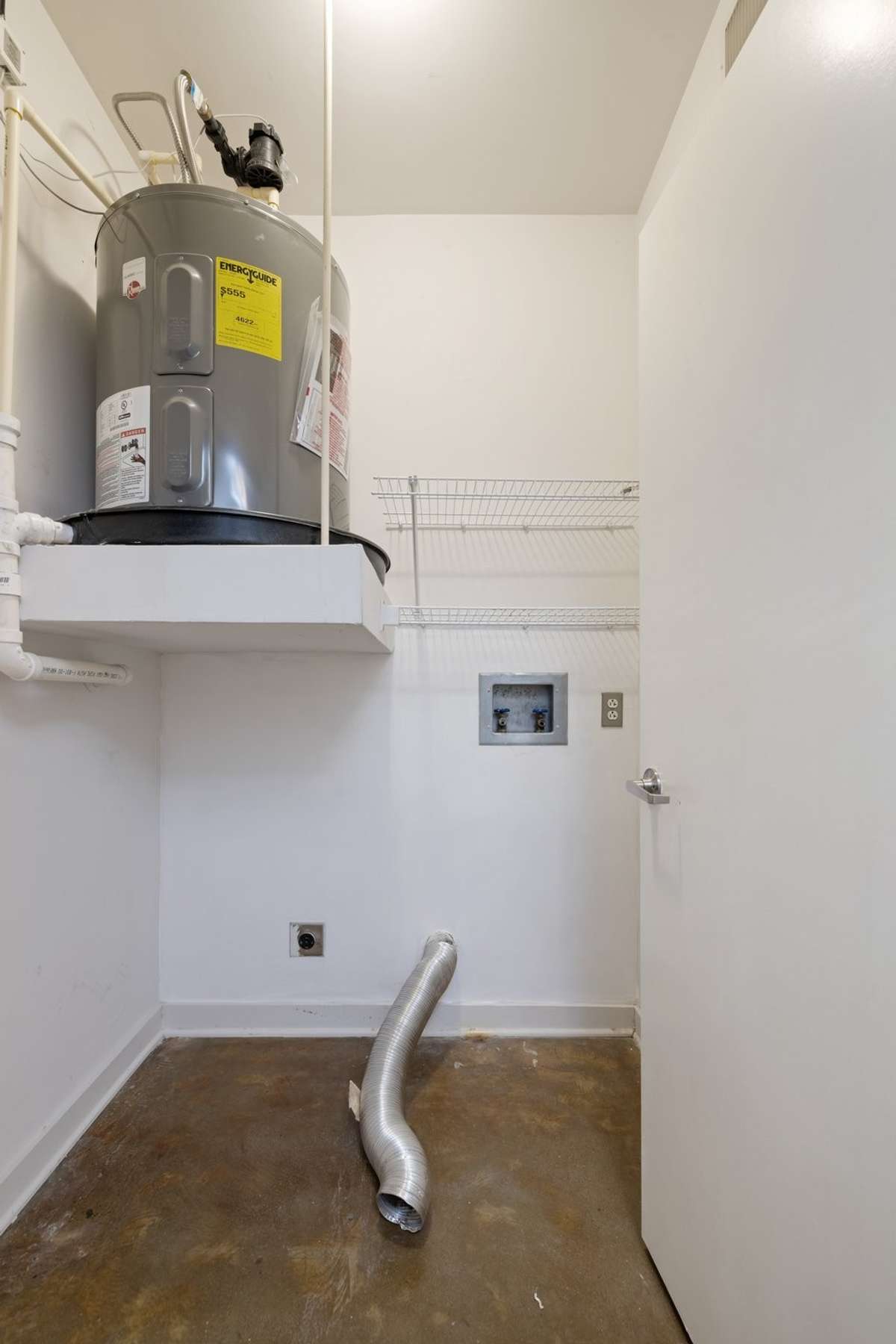Large walk-in laundry / storage room.