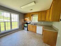 Kitchen includes stove and dishwasher, lots of natural light