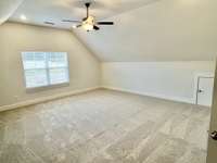 Large bonus room with a closet and a door for TV room, older child, guests....