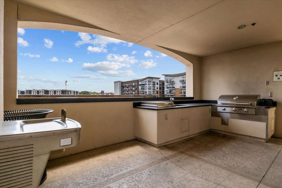 The common area includes a grill and prep area.