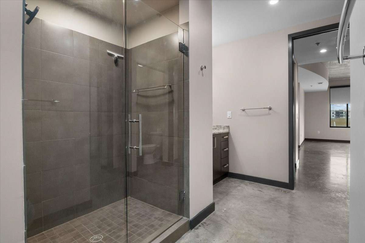 The bathroom is just off the bedroom area.