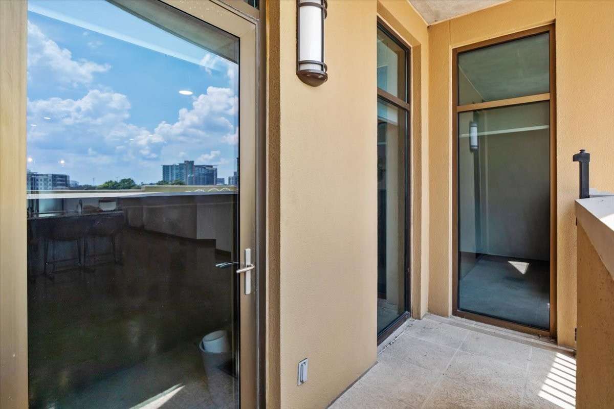Unit (back) door leading to the pool, entertainment area, and grilling area.
