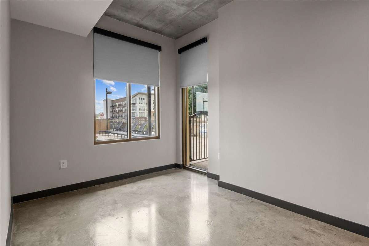Custom window treatments throughout the unit.