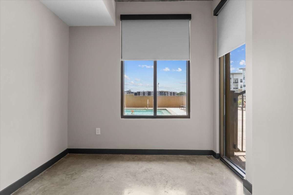 The primary bedroom overlooks the pool.