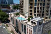 Aerial view of the building showcasing the pool and entertainment area on the 5th floor.