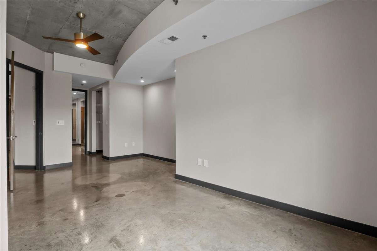 Notice the polished concrete floors and the exposed concrete ceiling.
