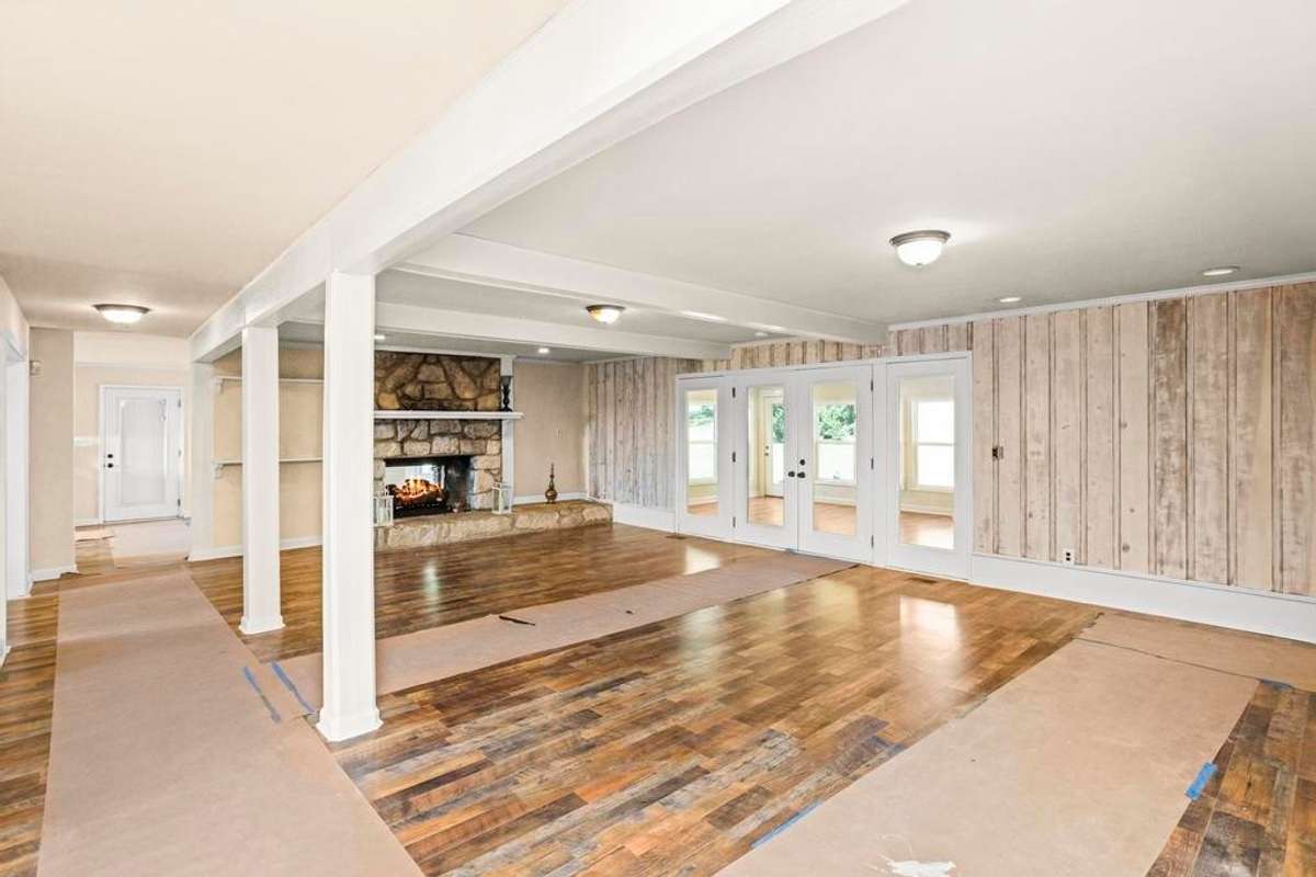 Large living room with double sided fireplace.