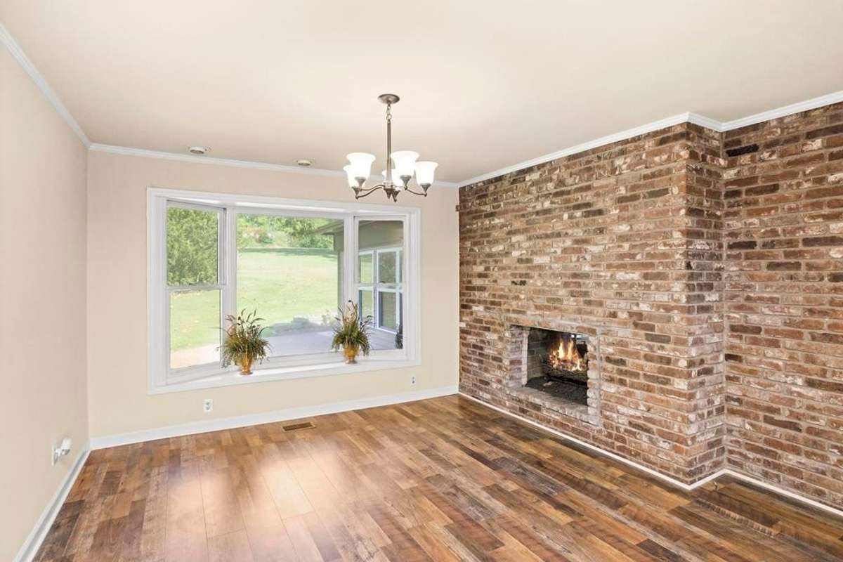 Bay window in the dining area with a double sided fireplace you can enjoy from 2 seperate rooms.