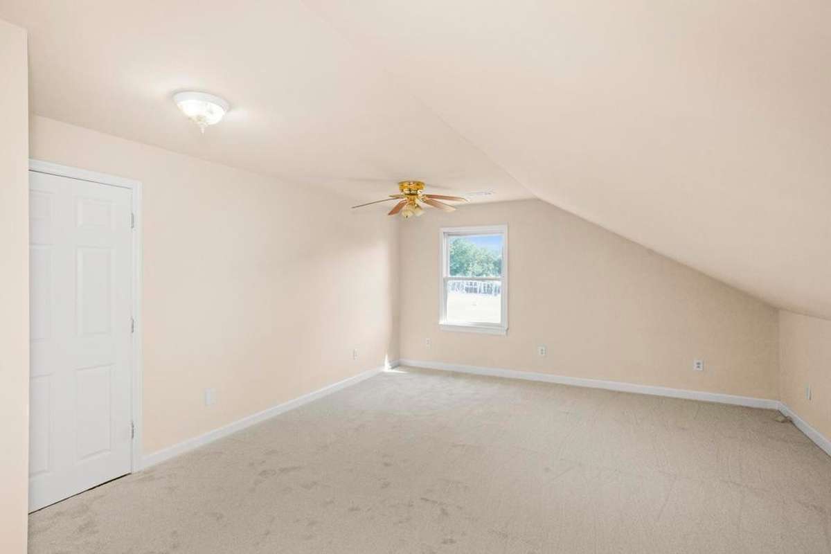 Bedroom located upstairs connected to it's own bathroom.