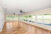 Large open concept sun room that is heated and cooled.