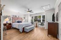 The primary bedroom is filled with natural light and offers generous space, complete with two closets.