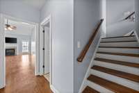 Stairs to bonus/4th bedroom - door on right is the laundry