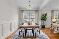 The open-concept dining, living, and kitchen areas create the perfect flow for gathering.