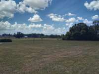 A peaceful setting with room to grow- ideal for anyone seeking privacy, fuctionality, and space to enjoy the outdoors.