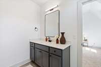 The third level has two additional bedrooms adjoined by a shared bath with separate vanities