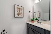 The third level has two additional bedrooms adjoined by a shared bath with separate vanities