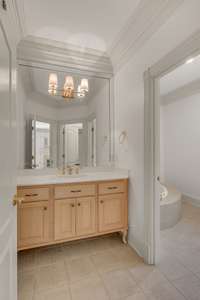 Bedroom 5- attached full bathroom with tile flooring, new vanity lights, separate tub, walk in closet