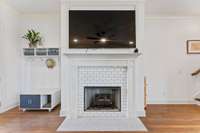 Gather, unwind, and enjoy the fireplace glow—this living room is made for real living.