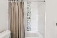 A chic barely-there shower niche...