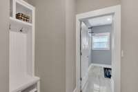 This built-in hall tree off of the garage/laundry will hold all the things you normally throw down as soon as you walk in the door.