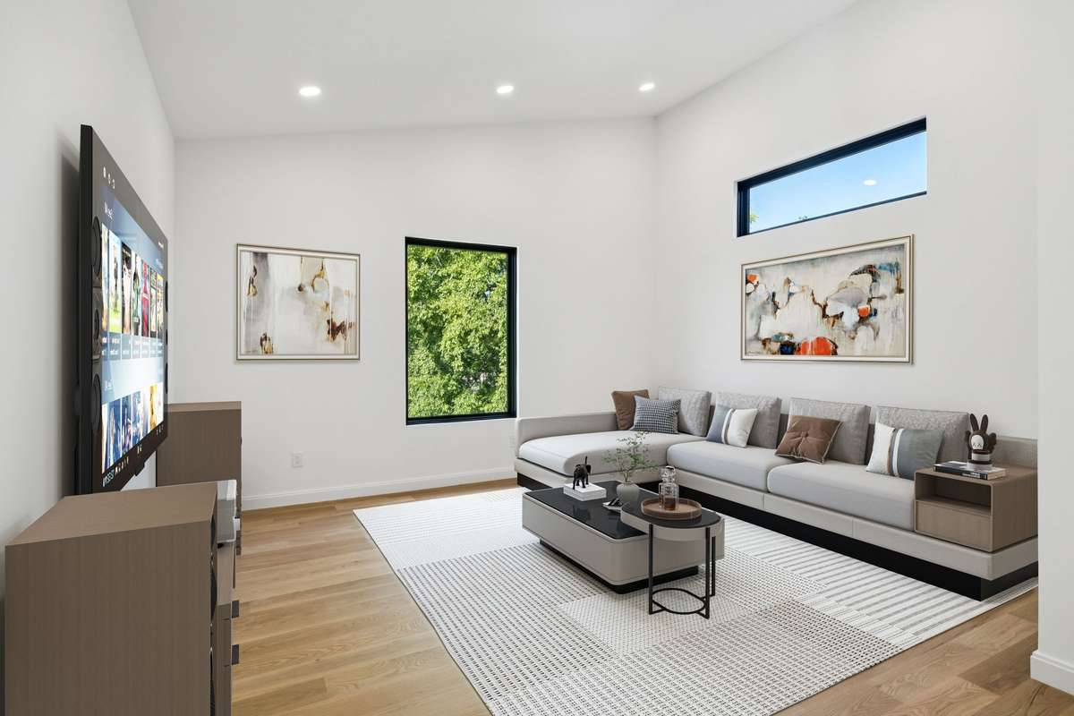 Upstairs TV Room - off the bonus room with double doors - digital staging